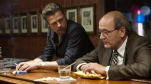 Enforcer Jacki Cogan (Brad Pitt) and mob bean-counter (Richard Jenkins) in Killing Them Softly