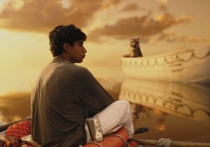 Pi (Suraj Sharma) adrift at sea with tiger Richard Parker in Life of Pi