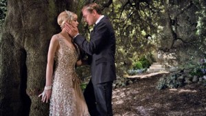 Daisy (Carey Mulligan) and Gatsby (Leonardo DiCaprio) steal a kiss in The Great Gatsby