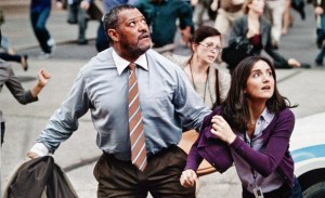 Daily Planet editor Perry White (Laurence Fishburne) and his staff take shelter in Man Of Steel