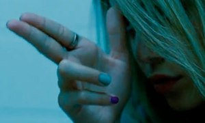 Brittany (Ashley Benson) pretends it's just a video game in Spring Breakers