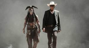Tonto (Johnny Depp) and John 'Lone Ranger' Reid (Armie Hammer) stride purposefully in The Lone Ranger