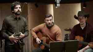 Please Mr Kennedy! Llewyn (Oscar Isaac) performs session guitar for friend Jim (Justin Timberlake) and Al Cody (Adam Driver) in Inside Llewyn Davis