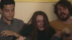 Mason (John Gallagher Jr) and Nate (Rami Malek) try to calm down tearaway teen Jayden (Kaitlyn Dever) in Short Term 12