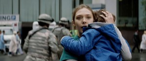A terrified Elle (Elizabeth Olson) and son hope for the safe return of husband Ford (Aaron-Taylor Johnson) in Godzilla