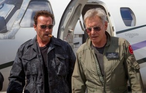 Arnold Schwarzenegger with trademark cigar as Trench Mauser opposite Harrison Ford's CIA operative Max Drummer in The Expendables 3